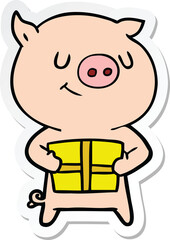 sticker of a happy cartoon pig with christmas present