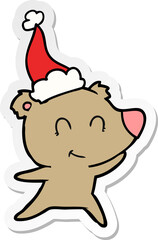 female bear sticker cartoon of a wearing santa hat