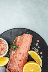 red fish, fresh fillet of salmon or trout steak, vertical image. top view. place for text