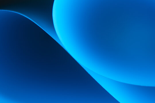 Blue abstract gradient wavy curved layers background.