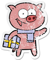 distressed sticker of a cheerful pig with christmas gift