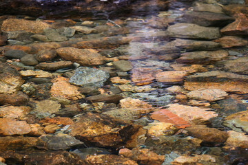 Colored rocks covered with water