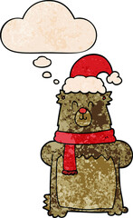 cartoon bear wearing christmas hat and thought bubble in grunge texture pattern style