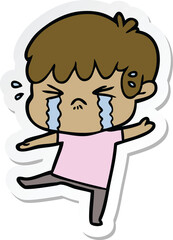 sticker of a cartoon boy crying
