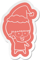 happy cartoon  sticker of a boy waving wearing santa hat