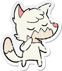 distressed sticker of a friendly cartoon fox