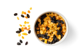 White and dark raisins in a bowl top view on a white background.
