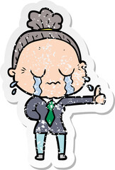 distressed sticker of a cartoon old woman crying