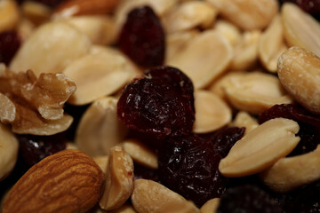 Mix of dried cranberries fruits almonds and nuts in a bowl close up modern background high quality big size stock photos prints