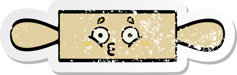 Fototapeta premium distressed sticker of a cute cartoon rolling pin