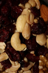 Mix of dried cranberries fruits almonds and nuts in a bowl close up modern background high quality big size stock photos prints