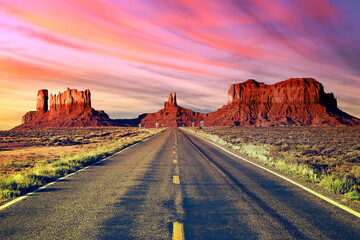 Long road at Monument Valley at sunset