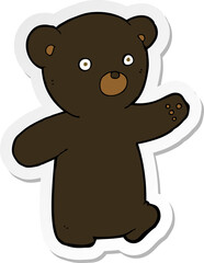 sticker of a cartoon black bear cub