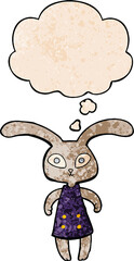 cute cartoon rabbit and thought bubble in grunge texture pattern style