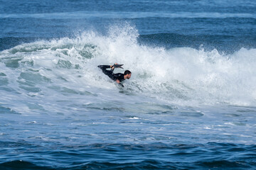 Bodyboarder surfing ocean wave