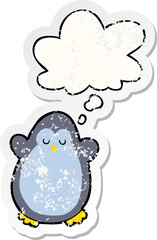 cartoon penguin and thought bubble as a distressed worn sticker