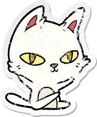 distressed sticker of a cartoon cat staring