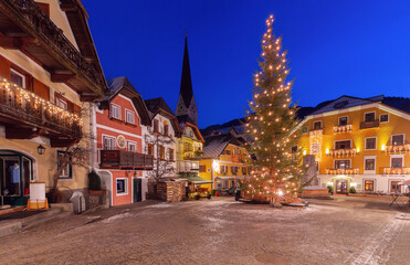 Hallstatt. Old town square with a Christmas tree on Christmas night.