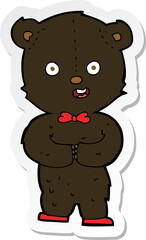 sticker of a cartoon teddy black bear