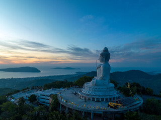 aerial photography scenery blue sky and blue ocean behind Phuket white big Buddha. Phuket white big Buddha is the .famous landmark in Phuket..Aerial panoramic view landscape Phuket big Buddha.