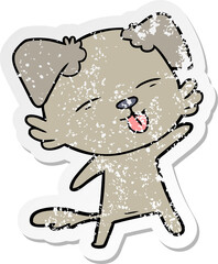 distressed sticker of a cartoon dog sticking out tongue