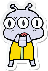 sticker of a cartoon three eyed alien