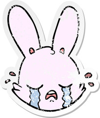 distressed sticker of a cartoon crying bunny face