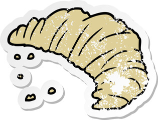 distressed sticker of a cartoon croissant
