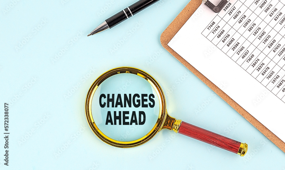 Poster changes ahead text on magnifier with clipboard on blue background