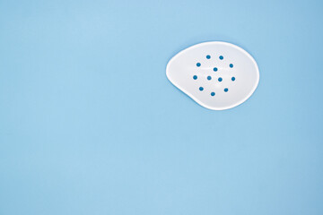 Eye shield for left eye, medical equipment for protect your eye after surgery on blue background