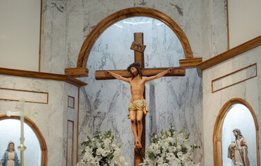 statue of jesus christ crucified in altar of catholic church