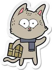 sticker of a cartoon cat holding christmas present