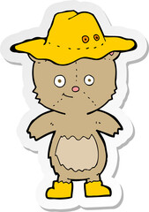 sticker of a cartoon bear in hat