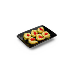 Shrimp in wasabi sauce on a black plate on a white background isolate