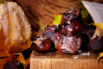 Roasted chestnuts with sea salt. Beautiful background. Rustic. Homemade food. Street food.