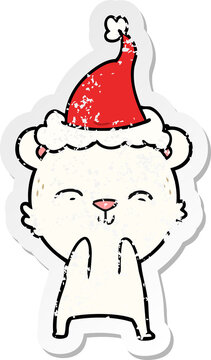 happy distressed sticker cartoon of a polar bear wearing santa hat