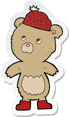 sticker of a cartoon bear in hat