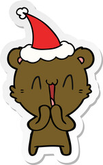 happy bear sticker cartoon of a wearing santa hat