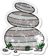 distressed sticker of a cartoon large stacked stones