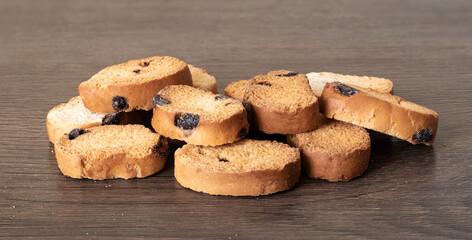 Crouton with raisins lie on a wooden table