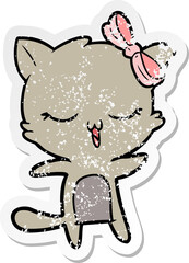 Obraz na płótnie Canvas distressed sticker of a cartoon cat with bow on head