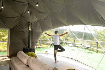men meditate and yoga at glamping for good health.