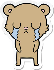 sticker of a cartoon bear crying