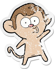 distressed sticker of a cartoon surprised monkey
