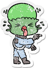 distressed sticker of a weird cartoon alien pointing