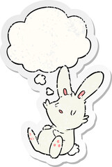 cartoon rabbit sleeping and thought bubble as a distressed worn sticker