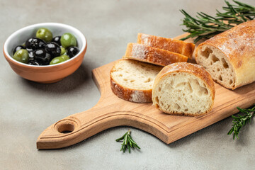 Ciabatta Bread with olive oil and olives. Food recipe background. Close up