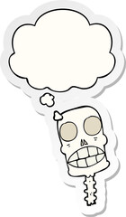 Obraz premium cartoon spooky skull and thought bubble as a printed sticker