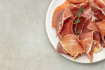 prosciutto, jamon, ham. Italian prosciutto crudo or jamon. Healthy food concept. place for text, top view