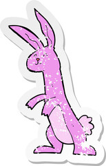 retro distressed sticker of a cartoon rabbit